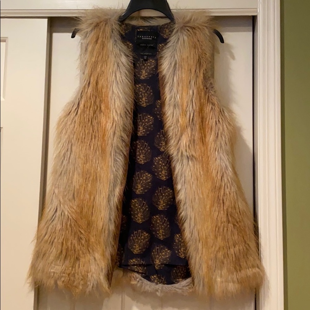 Faux fur vest, brown leather trim